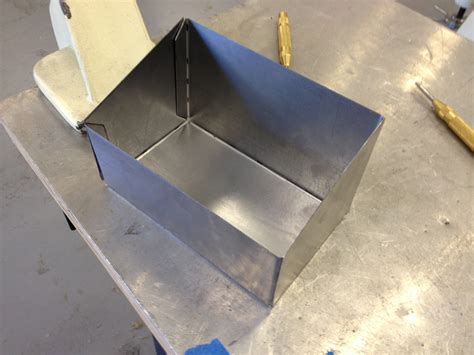 a metal worker is making a box|sheet metal box instructions pdf.